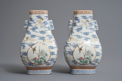 A pair of Chinese famille rose fanghu vases with cranes, Qianlong marks, 19/20th C.