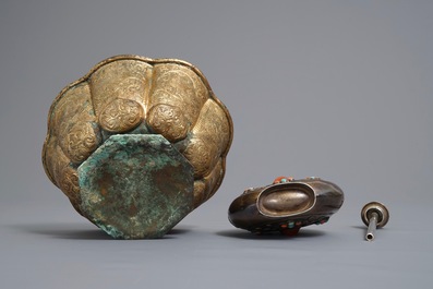 A gilt brass bowl and an inlaid silver flask, Tibet, 19/20th C.