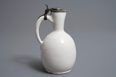 A white Dutch Delft jug with pewter cover, 17th C.