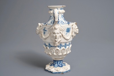 A Spanish blue and white two-handled vase with applied design and dedication, dated 1801