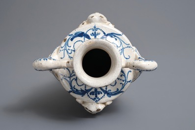 A Spanish blue and white two-handled vase with applied design and dedication, dated 1801