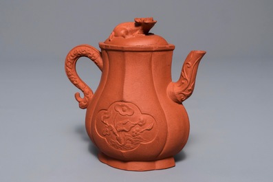 A Chinese Yixing stoneware wine jug with applied flowers and buffalo, Kangxi