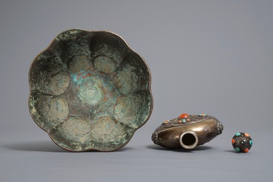 A gilt brass bowl and an inlaid silver flask, Tibet, 19/20th C.