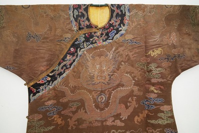 A Chinese brown ground eight-dragon embroidered silk robe, Qianlong