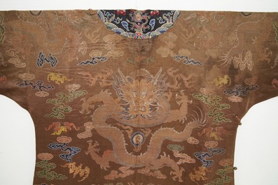 A Chinese brown ground eight-dragon embroidered silk robe, Qianlong