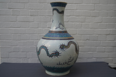 A pair of large Chinese doucai 'dragon' bottle vases, tianqiu ping, Qianlong mark, 19th C.