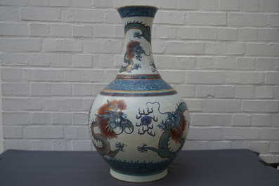 A pair of large Chinese doucai 'dragon' bottle vases, tianqiu ping, Qianlong mark, 19th C.