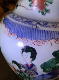 A Chinese wucai baluster vase and cover with playing boys, Transitional period