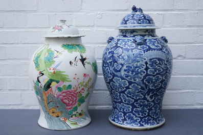 Two Chinese blue and white and famille rose vases and covers, 19/20th C.