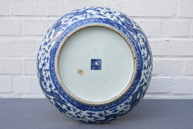 A Chinese blue and white 'dragon' dish, Qianlong mark, 19th C.