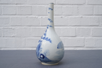 A Chinese blue and white bottle vase with a fisherman, 19th C.