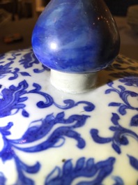 A Chinese blue and white 'lotus scroll' vase and cover, 19th C.