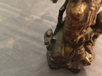 A Chinese gilt-lacquered bronze group of Guanyin with a child, 18th C.
