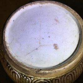 Three Chinese famille rose jars and covers and two bowls, 19th C.