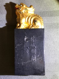 Eight Chinese parcel-gilt ink stones shaped as seals in display box, 18/19th C.