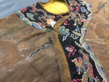 A Chinese brown ground eight-dragon embroidered silk robe, Qianlong