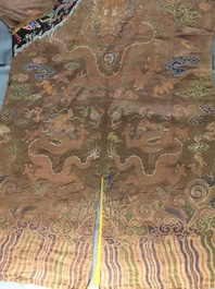 A Chinese brown ground eight-dragon embroidered silk robe, Qianlong