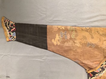 A Chinese brown ground eight-dragon embroidered silk robe, Qianlong