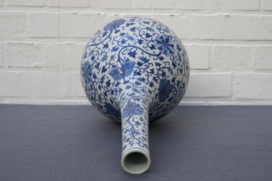 A Chinese blue and white 'lotus scroll' bottle vase, 18/19th C.