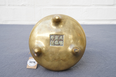 A Chinese bronze tripod censer, Xuande mark, 18th C.