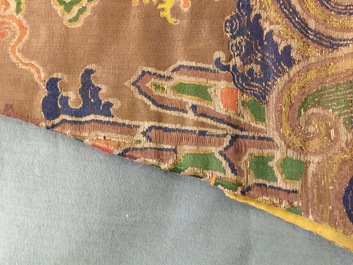 A Chinese brown ground eight-dragon embroidered silk robe, Qianlong