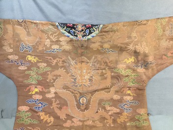 A Chinese brown ground eight-dragon embroidered silk robe, Qianlong