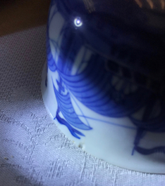 A pair of Chinese blue and white French market cups and saucers with texts, Kangxi