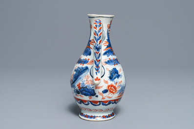 A clobbered Chinese blue and white ewer, Transitional period