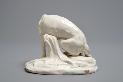 A white Dutch Delft model of a dog, 18th C.