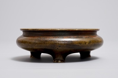 A Chinese bronze tripod censer, Xuande mark, Ming