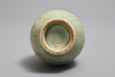 A Chinese relief-decorated celadon 'peony' vase, 18/19th C.