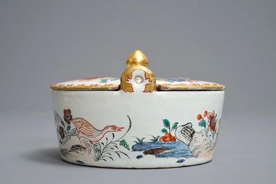 A polychrome petit feu and gilded Dutch Delft famille rose-style butter tub, 18th C.