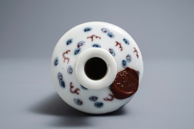 A Chinese blue, white and underglaze red 'dragon' vase, Kangxi mark, 19/20th C.