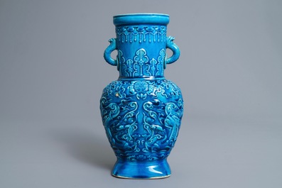 Een Chinese monochrome turquoise vaas met reli&euml;fdecor, 18/19e eeuw