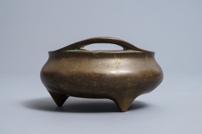 A Chinese bronze tripod censer, Xuande mark, 18/19th C.