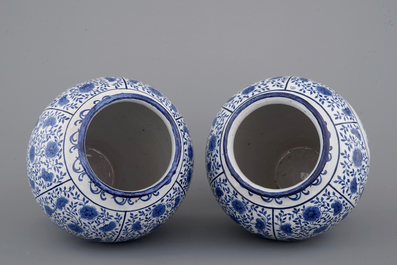 An impressive pair of blue and white Brussels faience covered vases, signed and dated 1861