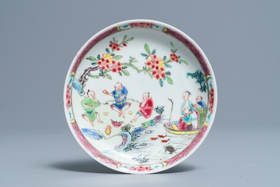 A fine Chinese famille rose cup and saucer with a river scene, Yongzheng