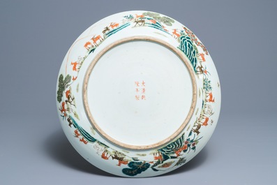 A large Chinese famille rose 'hundred deer' charger, Qianlong mark, 19th C.