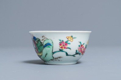 A fine Chinese famille rose cup and saucer with a river scene, Yongzheng