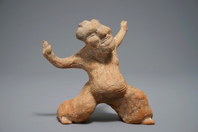 A Chinese pottery figure of a male dancer, Han