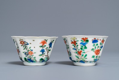 A pair of lobed Chinese famille verte cups and saucers, Kangxi