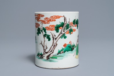 A Chinese famille verte brush pot on wooden stand, Kangxi