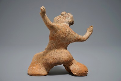 A Chinese pottery figure of a male dancer, Han