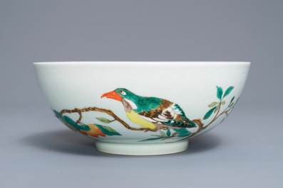 A Chinese famille verte 'birds on peach branches' bowl, Kangxi mark, 19th C.