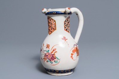 A polychrome petit feu and gilded Dutch Delft puzzle jug with insects and flowers, 1st half 18th C.