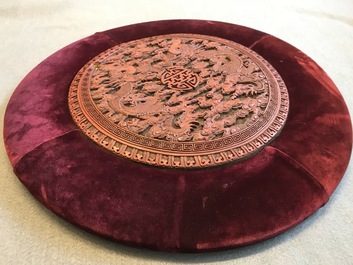 A round Chinese cinnabar lacquer plaque with two dragons, 18th C.