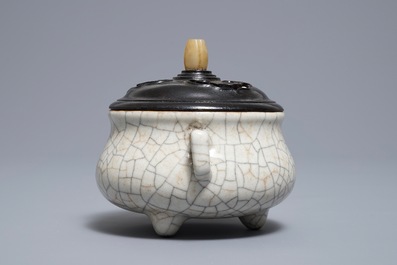 A Chinese ge-type crackle-glazed tripod censer and cover on stand, 19/20th C.