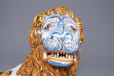 A massive French faience model of a lion, Rouen, late 19th C