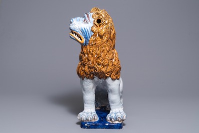 A massive French faience model of a lion, Rouen, late 19th C