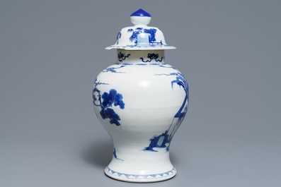 A Chinese blue and white vase and cover with ladies in a garden, 19th C.